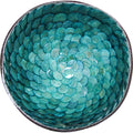 round bowl shape; iridescent blue colour; overlapping shell-like texture inside; slight gold edging visible; natural handmade material texture;