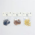 Three clear plastic packs each labelled "3 Bun Nets"; Visible bun nets in black, medium brown and light blonde; White hanging card packaging with Connice branding; Compact, lightweight net material inside each pack;