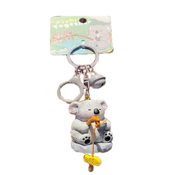 grey koala figure holding orange fishing rod; yellow fish charm attached to fishing line; small white bell charm; metal round keyring and clip; packaging card with 'Fish together' text and koala illustration;