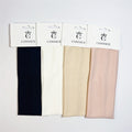 Wide rectangular fabric headbands; Horizontal ribbed weave texture; Neutral colours: dark navy, white, beige, blush pink; Each headband displayed on white CONNICE branded card;