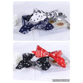 Fabric headbands with paisley bandana-style print; Prominent bow knot detail at the top; Colours shown include navy, white, black and red; Soft, flexible band shape suitable for wrapping around head;