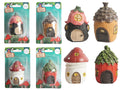 small tree house figurine; hand-painted with natural colours; mushroom and tree shapes; packaged in clear blister with green backing card; features small windows and doors;