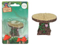 Miniature tree stump table shape; Light wood-coloured top with wood grain pattern; Brown bark texture on base; Green vine and pink flower decoration on side;