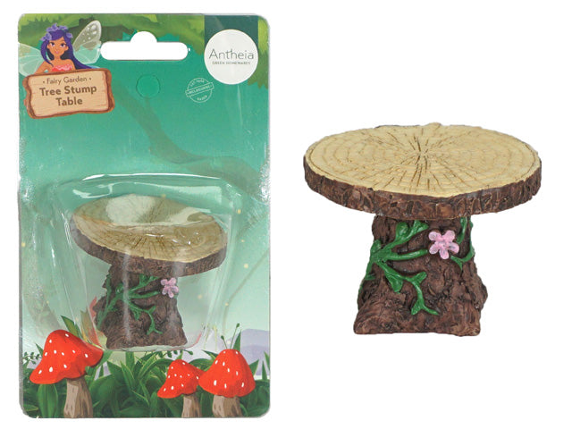 Miniature tree stump table shape; Light wood-coloured top with wood grain pattern; Brown bark texture on base; Green vine and pink flower decoration on side;