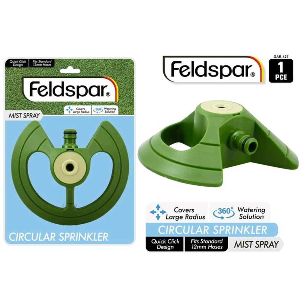 Green circular sprinkler with a beige centre; Made from plastic material; Designed to fit standard 12mm hoses; Compact size with three-legged base; Brand name Feldspar on packaging;