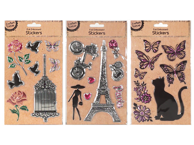 Foil embossed metallic finish; Various designs including Eiffel Tower, butterflies, cat silhouette; Colours include silver with hints of purple and green; Presented on brown craft-style backing card;