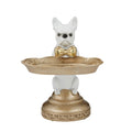 white Frenchie dog figure; gold decorative tray held by dog; gold bow tie on dog; ornate gold circular base; resin material finish;