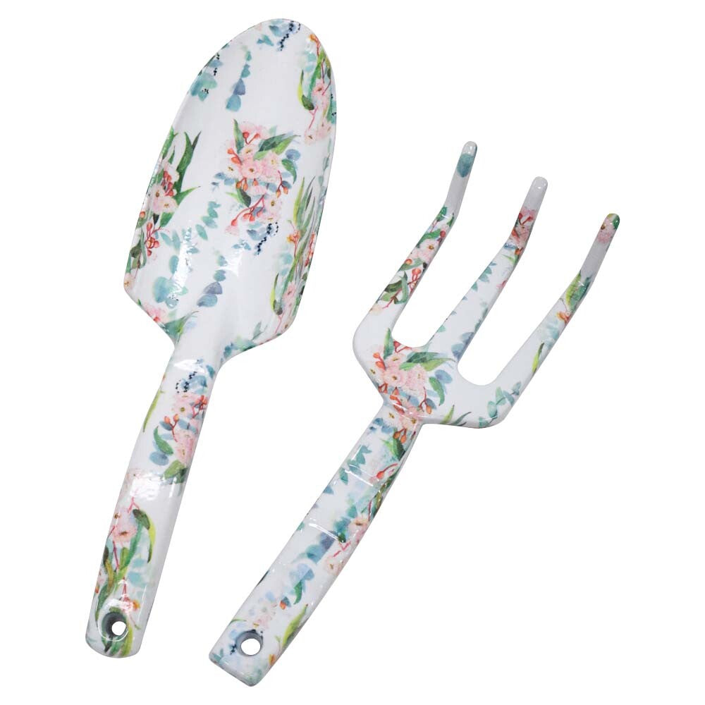 two garden tools including a shovel and a three-pronged rake; white enamel finish with pink and green floral pattern; metal material with glossy surface; handles have holes for hanging;