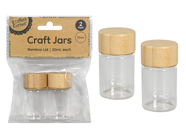 clear glass jars; natural bamboo lids; small cylindrical shape; pack of 2; simple eco-friendly design;