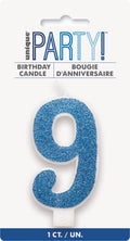 royal blue glitter covering; number 9 shaped candle; white candle base; packaged on white card with blue band; 8cm height indicated;