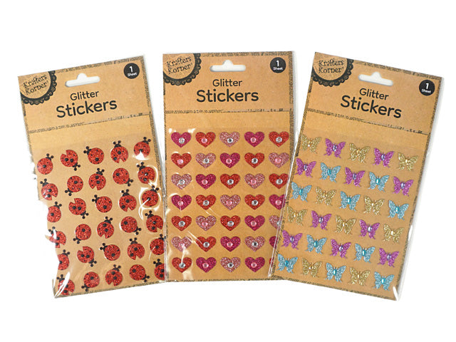 three sticker sheets in one pack; designs include ladybugs, hearts, butterflies; colours: red, pink, blue, purple, gold; stickers have glitter and rhinestone embellishments; kraft paper backing with clear packaging;