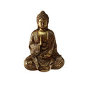Gold-coloured seated Buddha figurine; Made from resin with metallic finish; Detailed flowing robes with carved folds; Curled hair texture and serene facial expression;