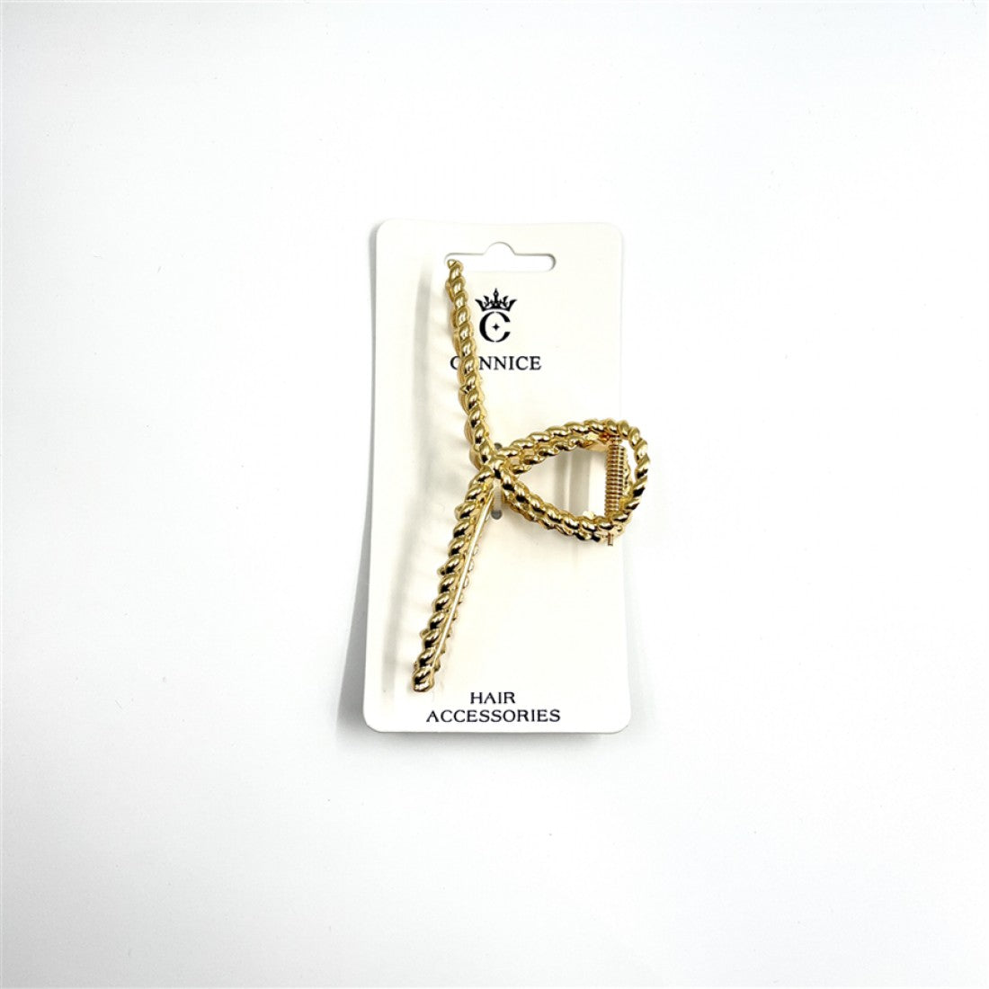 Gold-tone metal claw clip; Twisted rope-style texture; Crossed, open design shape; Mounted on white branded backing card;