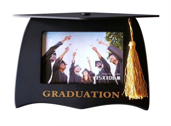 Black graduation cap shape; Gold tassel attached to top corner; Gold 'GRADUATION' text at base; Holds a 6x4 inch photo;
