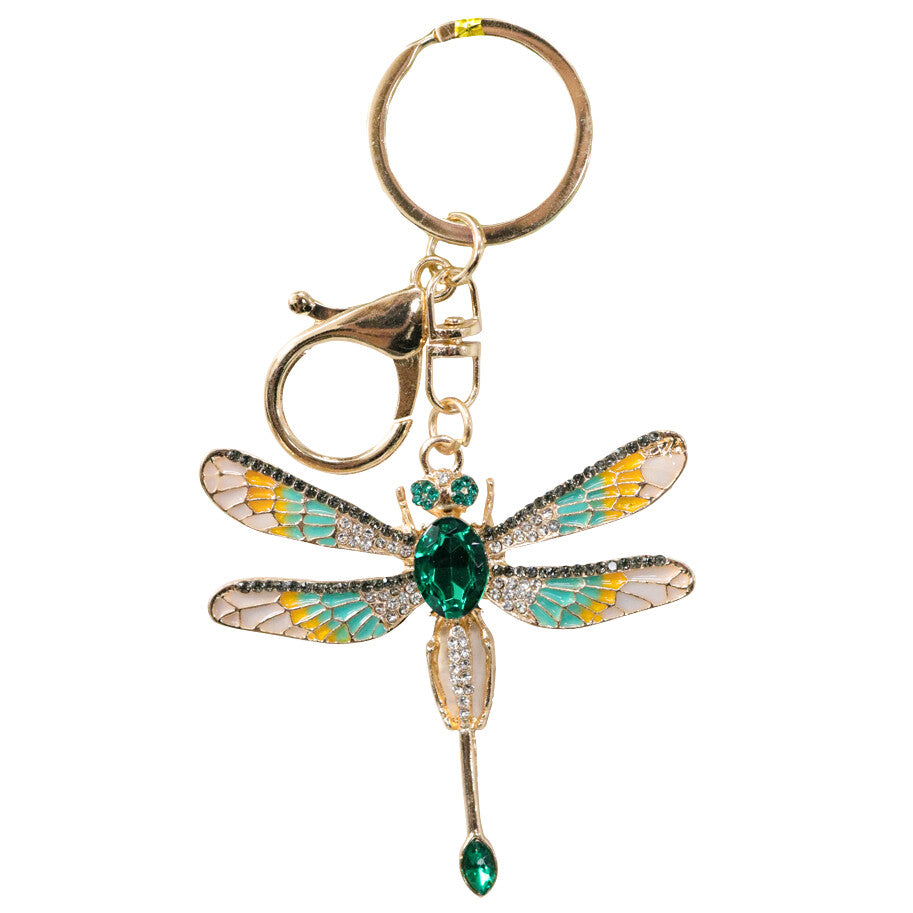 dragonfly shaped pendant; gold-tone metal finish; green, yellow and clear stones; attached keyring and clip; size approximately 5x7cm;