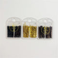 Hair pins shown in black, gold and brown tones; Pins stored in clear plastic cases; Packaging printed with brand name and 50 pack text; Cases have a round hole at top for hanging or carrying;