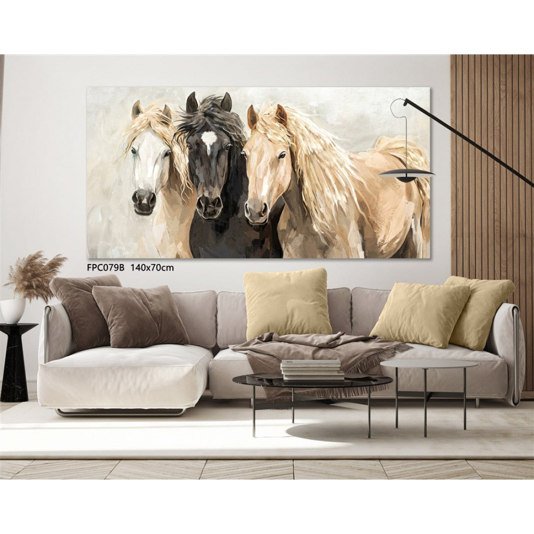 Large horizontal canvas; Neutral beige and brown colours; Features three horses; Mounted in a slim frame; Displayed above a sofa;