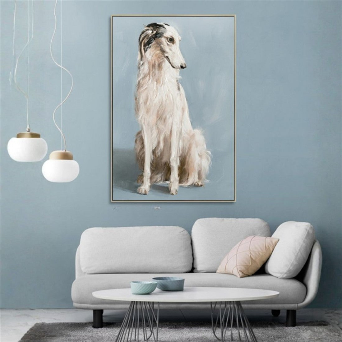 Framed canvas print; Light grey and beige dog on blue background; Rectangular shape; Muted colour palette; Thin gold frame;