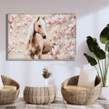 hand painted canvas artwork; depicts horse with white mane; soft beige and pink floral background; rectangular shape with thin frame; large size suitable for walls;