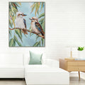 hand painted canvas; kookaburra birds on branch; soft blue background; green eucalyptus leaves; framed canvas with depth;