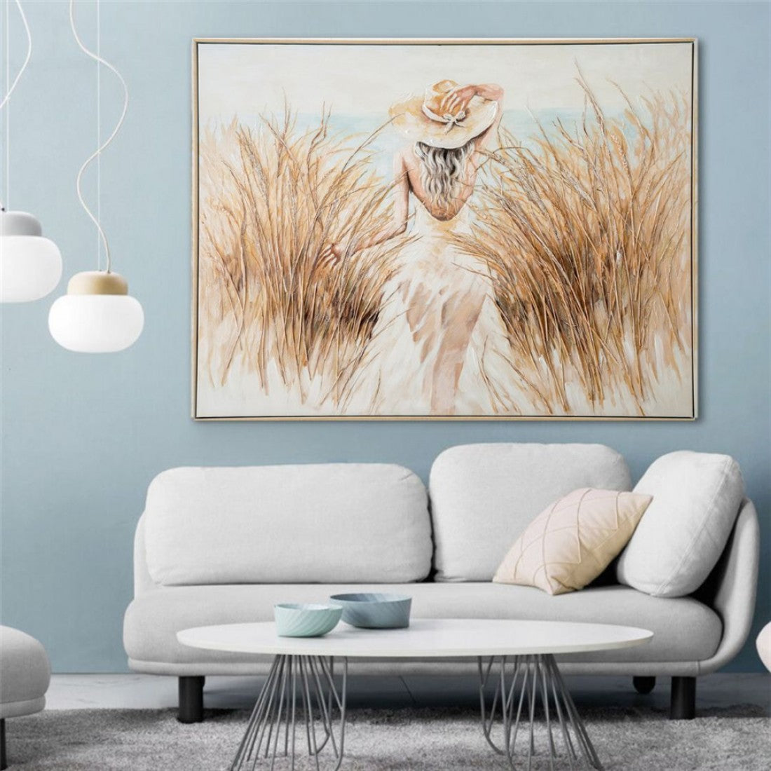 framed artwork; muted natural colours; woman wearing hat walking through tall grass; rectangular shape; approximate size 122.5x92.5cm;