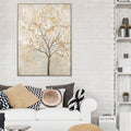 Large rectangular framed print; Tree design with white and beige leaves; Neutral beige and cream colour tones; Slim black frame; Textured brushstroke painting style;