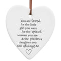 white ceramic heart shape; black printed text message on front; small heart graphic at bottom; suede hanging cord attached at top;