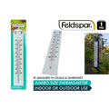 white rectangular body; black temperature scale markings in °C and °F; red liquid indicator; plastic material; packaged with green and white label;