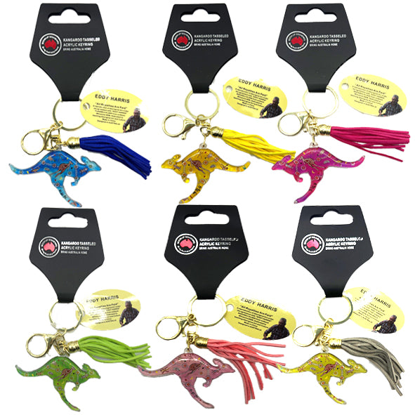 Acrylic kangaroo-shaped charm with patterned design; Colorful soft tassel attached to keyring; Gold metal keyring and lobster clasp; Product packaging with black card backing; Multiple colour options visible;