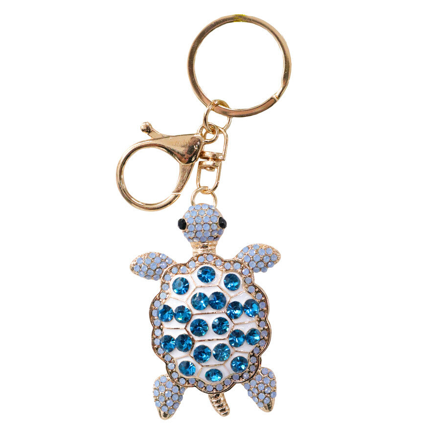 blue turtle shape; rhinestone shell; gold metal edges; lobster clasp and keyring attachment; metallic shimmer finish;
