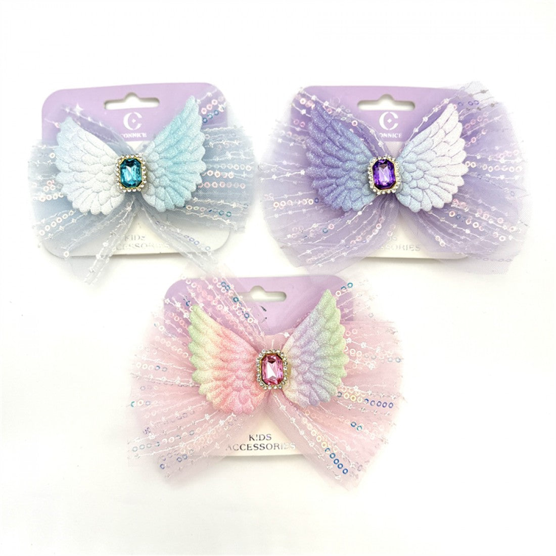 Large layered organza bow with sequins; Pastel colours including blue, purple and pink tones; Angel wing embellishment at the centre; Gemstone-style centrepiece with decorative border; Packaged on lavender backing card labelled for kids accessories;