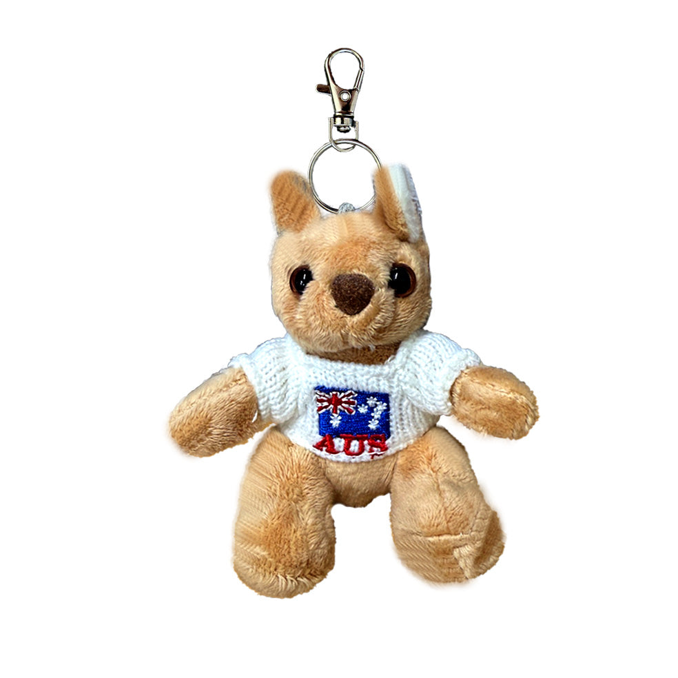 plush koala toy; light brown colour; white knitted sweater with embroidery; metal keyring and clasp attached;