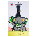 grey koala shape holding green leaves; soft silicone material; black adjustable strap; mounted on white and yellow backing card with Australia text;