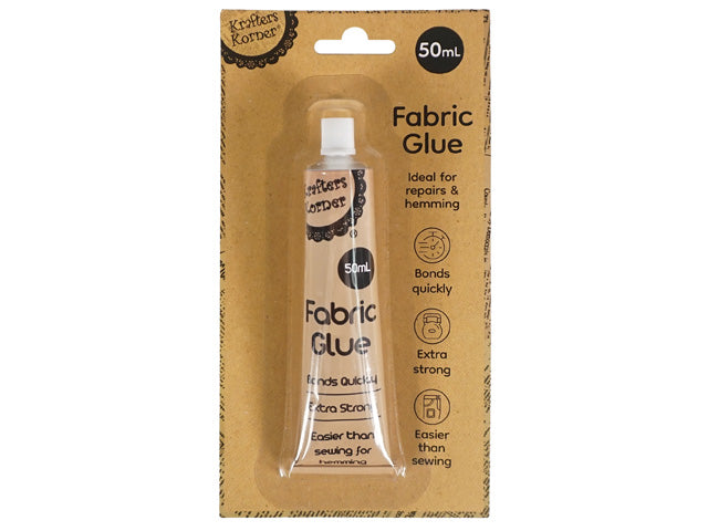 brown kraft paper backing packaging; transparent plastic blister; 50ml silver tube with black text; tube labelled 'Fabric Glue' and 'Krafters Korner' logo; bullet points on packaging for quick bonding and strong hold;
