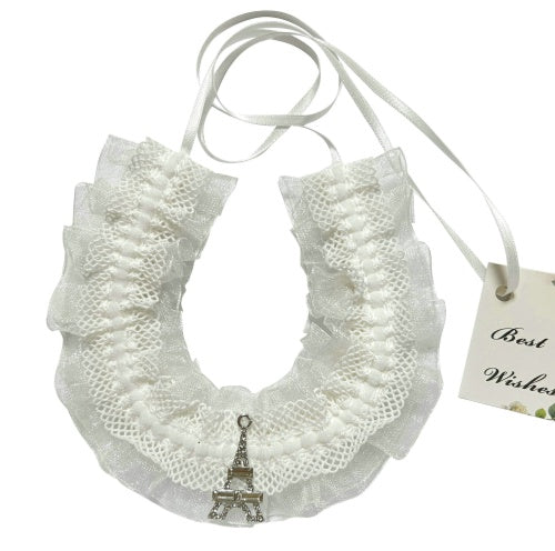 white lace with ruffled edges; silver Eiffel Tower charm pendant; thin white ribbon tie; delicate, lightweight design;