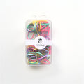 Pastel multi-coloured hair elastics; Clear rectangular plastic storage box; White wrap-around label with CONNICE branding; Compact box with hanging tab at the top;