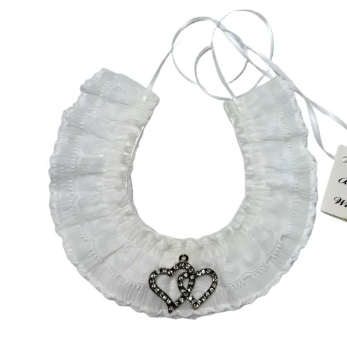 white layered lace fabric; ruffled lace design; double hearts pendant with small sparkling details; thin white ribbon ties for fastening;