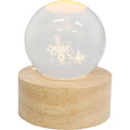 clear glass sphere; etched octopus and stars; warm LED light inside; natural wood circular base;