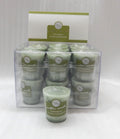 pale green solid colour candle; small votive size; label reads Lemongrass; packaged in clear plastic box; candle has wick on top;