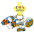 set of 4 metal keyrings attached to a silver-colored ring; each keyring has a distinct Melbourne cityscape or Australian scene design; round, rectangular and bottle opener keyring shapes; colourful printed artwork on white metal base; packaged with a yellow card labelled 'Australia' with koala and kangaroo;