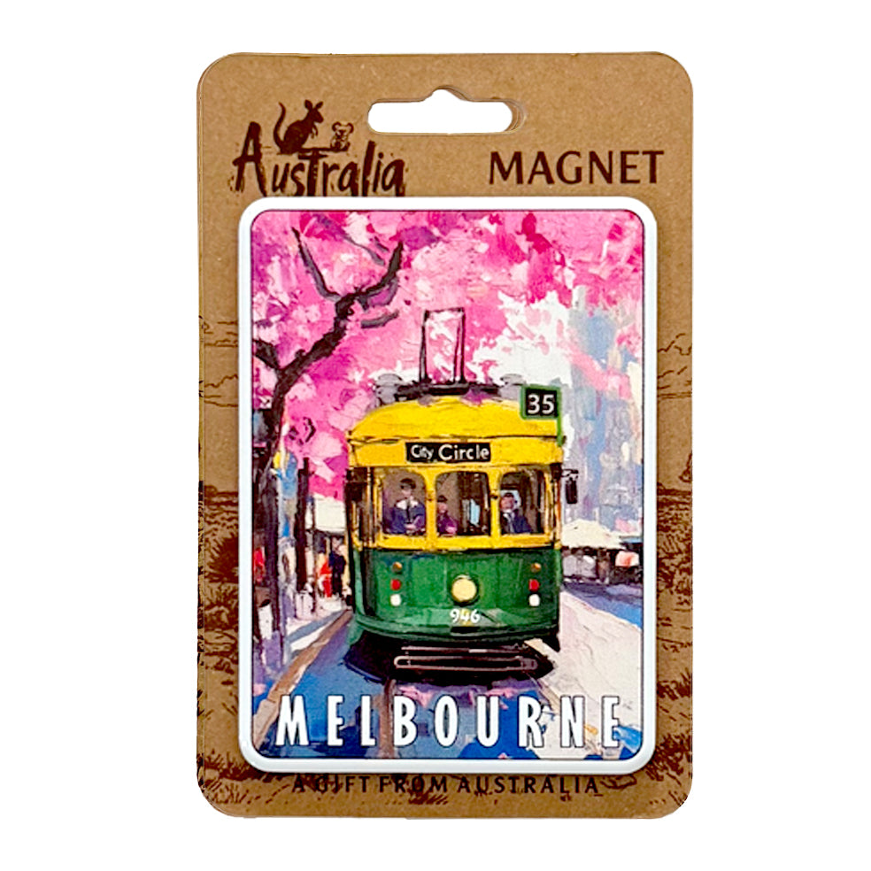 Rectangular metal magnet; Colourful illustration of Melbourne tram; Yellow and green tram with pink blossom background; White MELBOURNE text at bottom; Packaged on brown backing card;