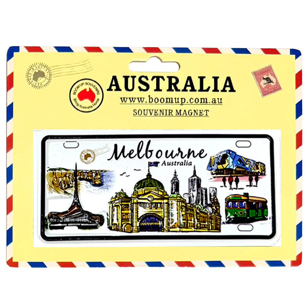 Rectangular white number plate with black border; Coloured illustrations of Melbourne landmarks; Yellow cardboard backing with red and blue striped border; Souvenir magnet printed with "Melbourne Australia" text;