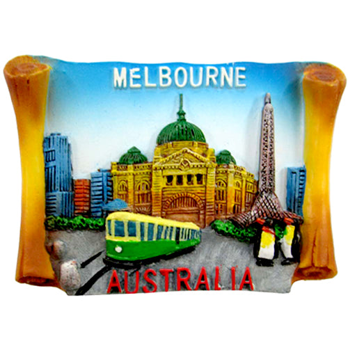 Scroll-shaped resin magnet; Detailed Melbourne cityscape artwork; Bright colours including blue, green, yellow; Text 'MELBOURNE' and 'AUSTRALIA' on magnet; Miniature tram and buildings depicted;
