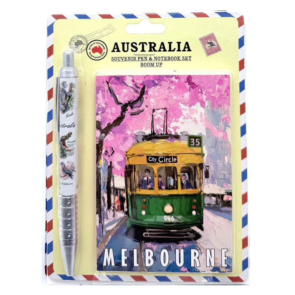 notebook with City Circle tram artwork on cover; pen decorated with Australian animals; pink and yellow colour scheme on notebook; packaged in blister display; pen has silver grip area;