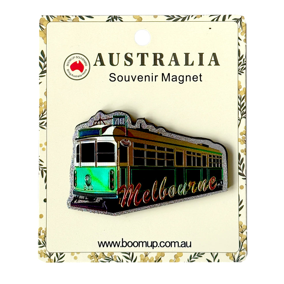 trademark Melbourne tram shape; vibrant green and yellow colours; PVC material with a shiny finish; packaged on decorative card backing; 'Melbourne' lettering in script style;