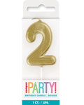gold colour; number 2 shape; candle with pick; packaged in clear blister pack; approximate height 8cm;