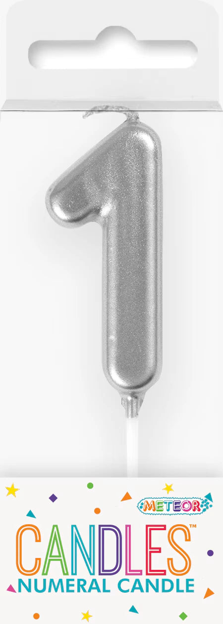 Silver coloured candle; Shape of numeral '1'; Glossy finish; Includes white pick base; Packaging shows 'Meteor Candles' branding;