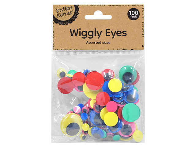 clear plastic packaging with kraft paper header; black text 'Wiggly Eyes Assorted sizes' on header; variety of round wiggly eyes in neon red, yellow, green, blue; eyes have black centres with coloured rims; pack contains 100 pieces;