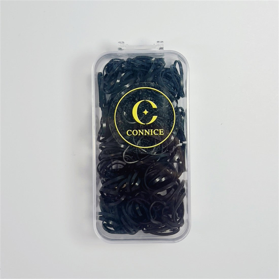 Small black elastic hair bands; Packed in a clear rectangular plastic case; Gold circular logo with the word "CONNICE" on the front; Compact case with flip-top style lid;