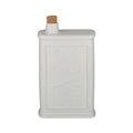 white matte ceramic material; rectangular shape with embossed front; cork stopper on top; dimensions approx. 12x6x22cm;